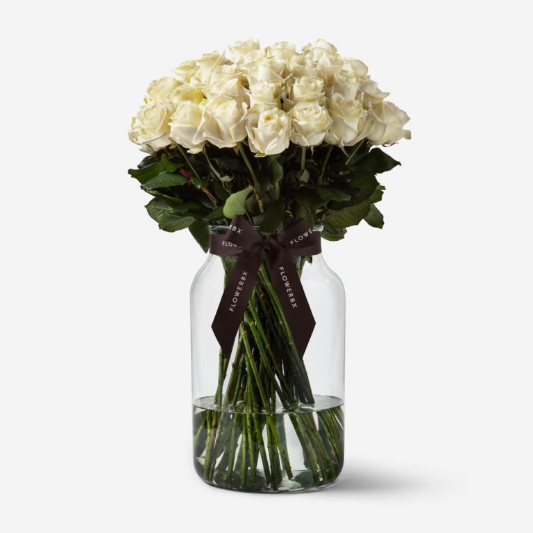 50 Ivory Avalanche Rose Stems in a Medium Apothecary Vase