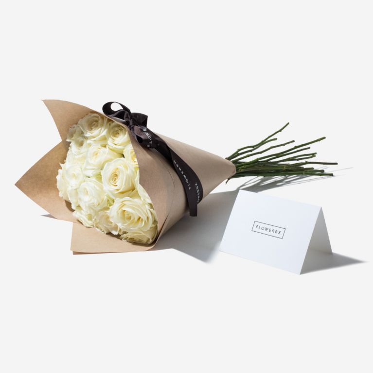 20 Ivory Avalanche rose stems wrapped in our signature gift wrapping. Available at checkout.