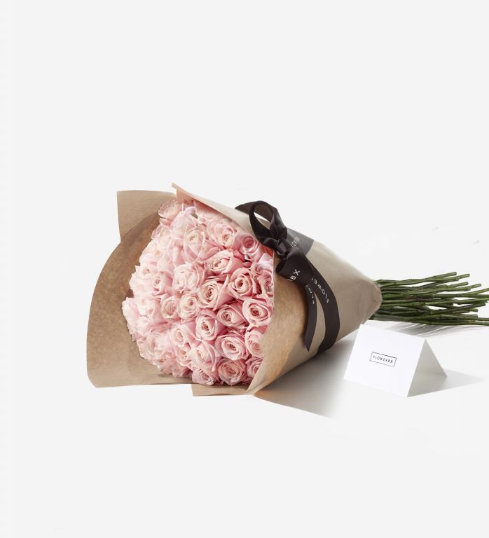 50 Pink Sweet Avalanche rose stems wrapped in our signature gift wrapping