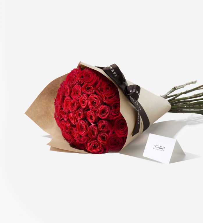 50 Red Naomi rose stems wrapped in our signature gift wrapping