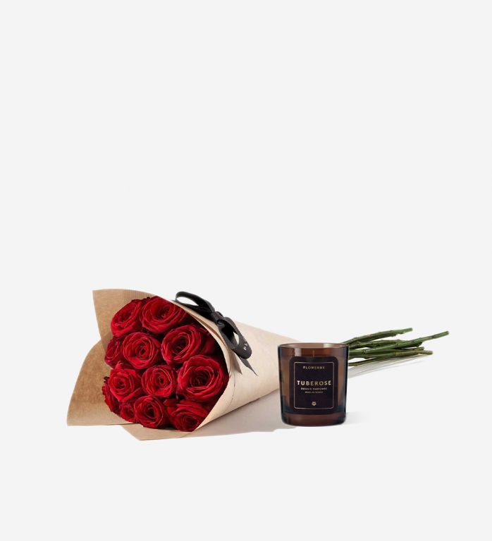 12 Red Naomi rose stems wrapped in our signature gift wrapping with Scented Candle