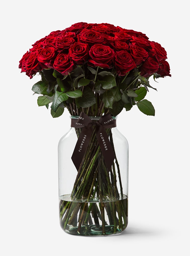 50 Red Rose Stems in a Glass Vase