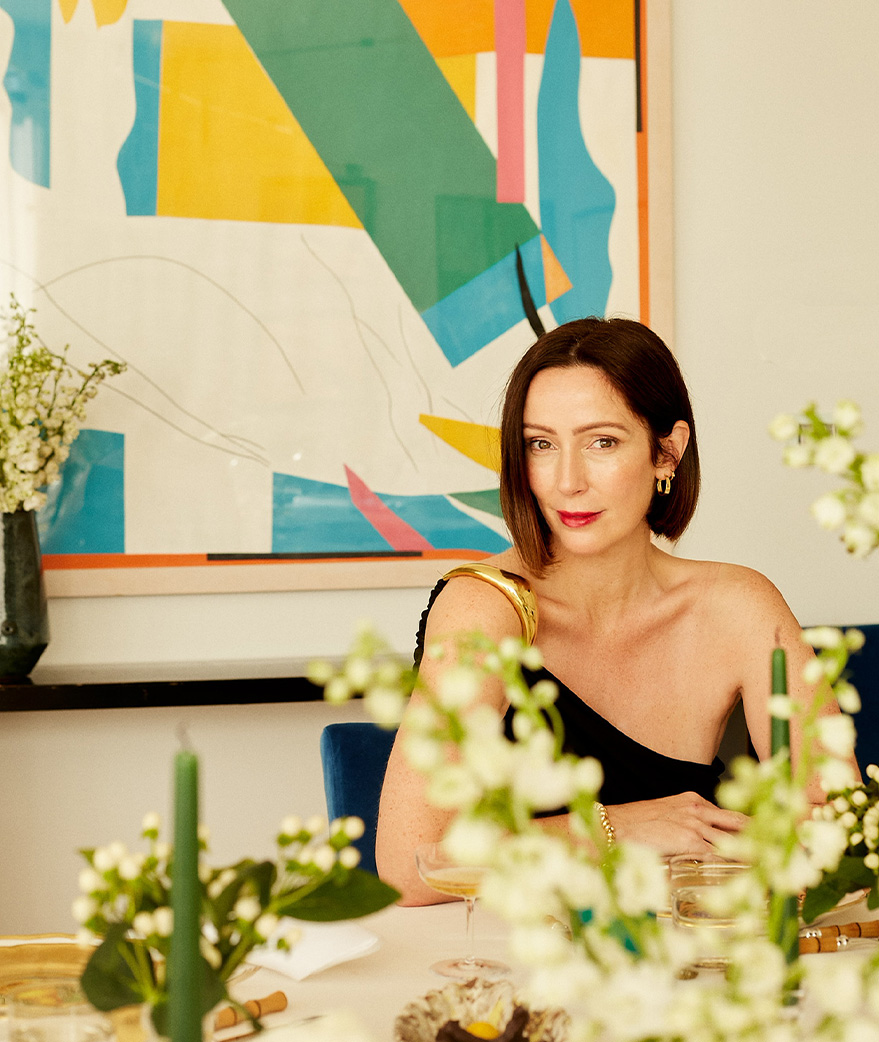 Zoë de Givenchy sitting at a dining table